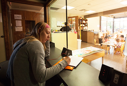 Student in observation room in the Jean Tyson Child Development Center.