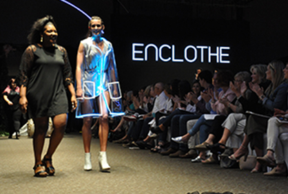 Student designer and model doing final walk at the 2018 Enclothe Fashion Show.